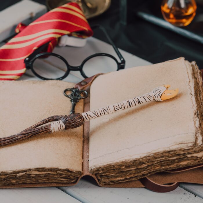 Photo by RODNAE Productions: https://www.pexels.com/photo/close-up-shot-of-a-wand-beside-a-spell-book-7978986/