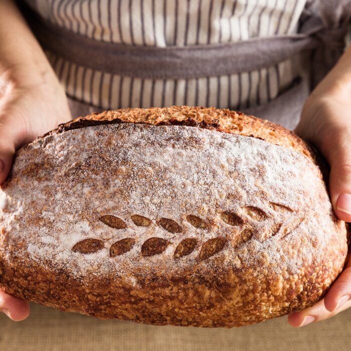 Photo by FRANCIANO PUHALES [FF8]: https://www.pexels.com/photo/person-holding-loaf-of-bread-13247705/